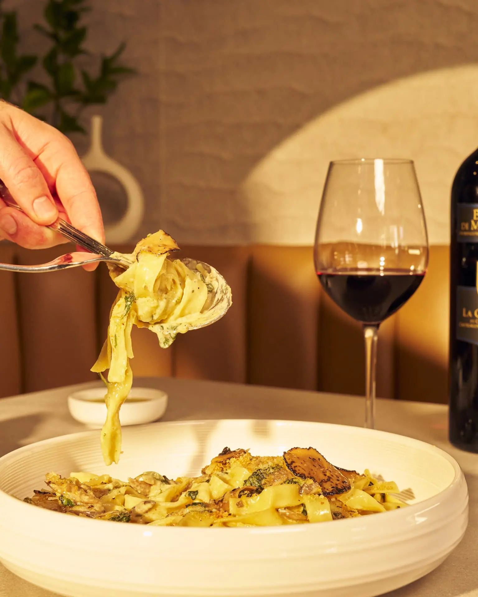 Handcrafted pappardelle with truffle and a glass of red wine at Five Corners Ristorante
